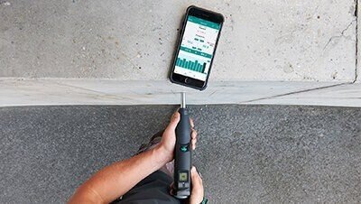 Handheld device scanning concrete